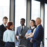 cheerful-business-team-discussing-project-2023-11-27-05-21-21-utc