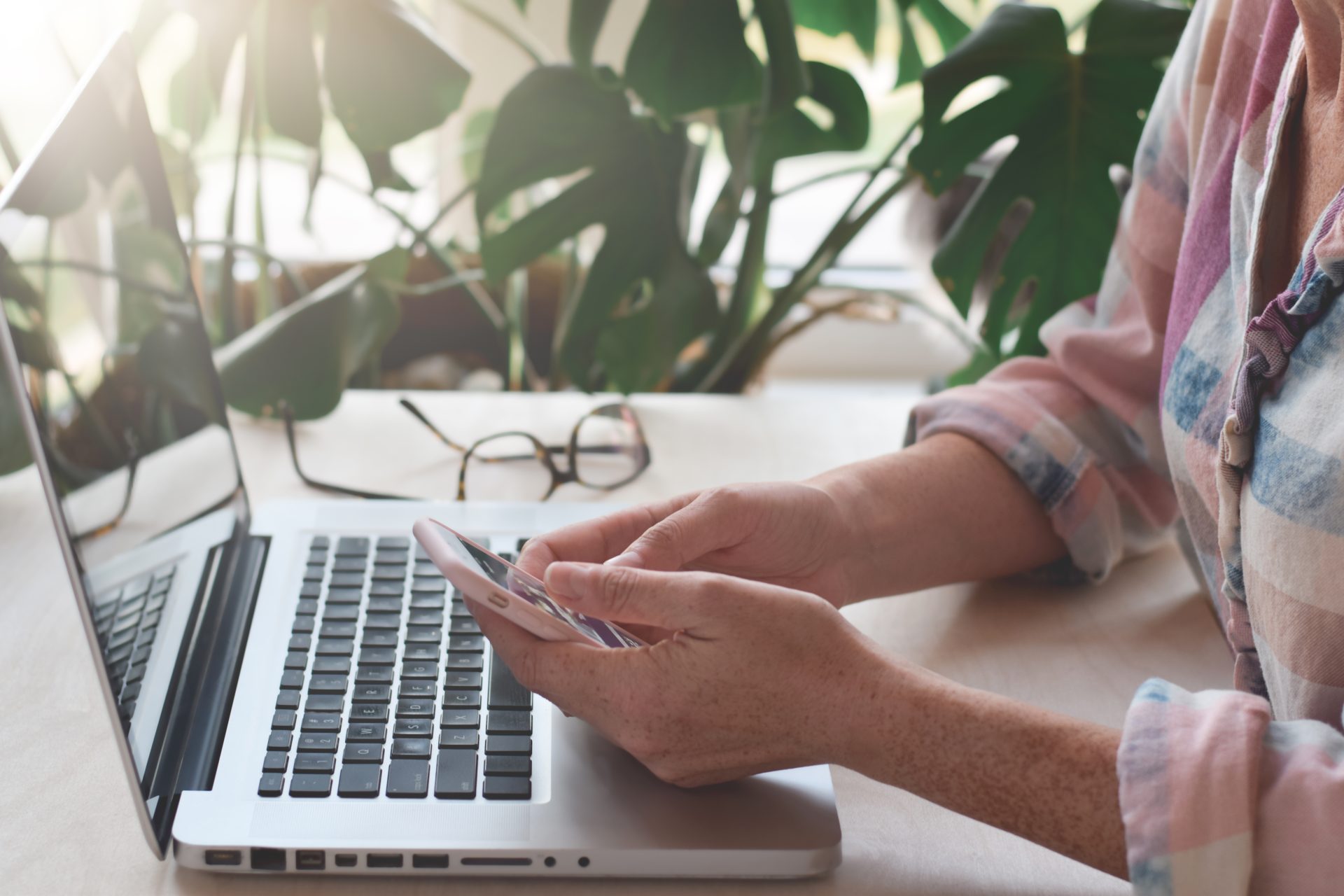 woman-uses-phone-while-working-at-home-2026-03-24-07-56-44-utc